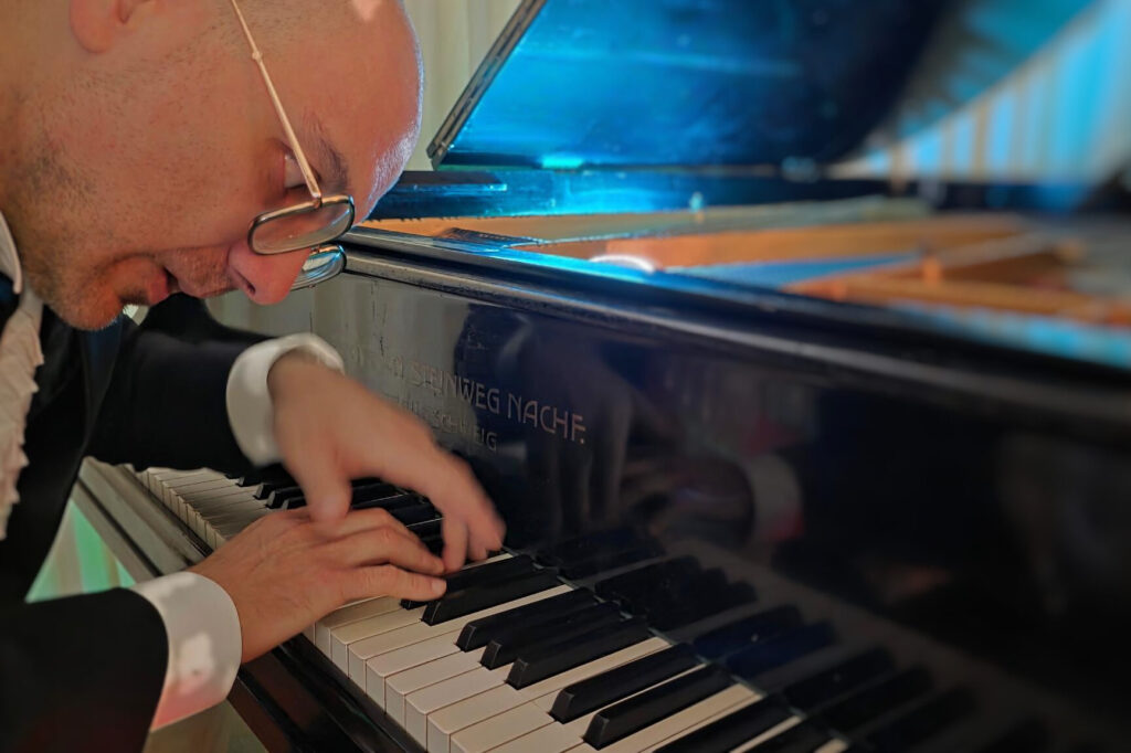 Bastian Lee Jones performing at his historic Grotrian-Steinweg grand piano in the recording studio.
