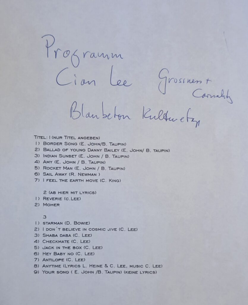 Typed programme and setlist for the first Cian Lee solo concert at BLAUBETON, listing cover songs alongside original works such as Reverie, I Don’t Believe in Cosmic Jive, Shaba Daba, Checkmate, Jack in the Box, Hey Baby No, Antilope, and Anytime.