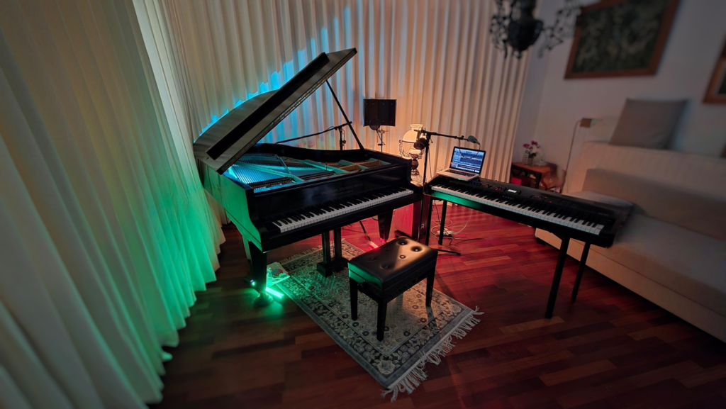 Bastian Lee Jones recording studio with historic Grotrian-Steinweg grand piano, keyboard, microphones and recording setup.